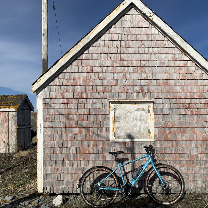 e bike on red fisherman shack